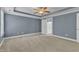 Spacious main bedroom with large windows, tray ceilings, ceiling fan and en-suite bathroom access at 4727 Smarty Jones Dr, Knightdale, NC 27545