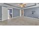Spacious main bedroom with large windows, tray ceilings, ceiling fan and en-suite bathroom access at 4727 Smarty Jones Dr, Knightdale, NC 27545