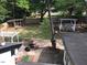 Aerial view of Backyard oasis with gazebo, patio, and mature trees at 5002 Wickham Rd, Raleigh, NC 27606