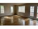 Bright living room features hardwood floors, white trim, and plenty of natural light at 5002 Wickham Rd, Raleigh, NC 27606