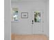 Clean entryway with natural light, a transom window, and white trim at 5049 Lundy Dr # 102, Raleigh, NC 27606