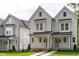 Inviting two-story home with a covered front porch, perfect for relaxing outdoors at 5049 Lundy Dr # 102, Raleigh, NC 27606