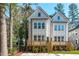 Charming exterior featuring a backyard deck with wood stairs on a sunny day at 5049 Lundy Dr # 102, Raleigh, NC 27606