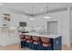 Modern kitchen with white cabinets, stainless steel appliances, and a center island with seating at 5049 Lundy Dr # 102, Raleigh, NC 27606