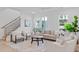 Bright living room features white walls, hardwood floors, and an abundance of natural light at 5049 Lundy Dr # 102, Raleigh, NC 27606