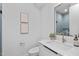 Stylish powder room features modern fixtures, a sleek vanity, and trendy blue tiling at 511 S Bloodworth St # 102, Raleigh, NC 27601