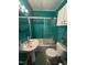 Functional bathroom featuring a pedestal sink, shower-tub combination, and practical layout at 514 E Lee St, Smithfield, NC 27577