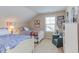 Bright bedroom featuring two twin beds, a sitting chair and natural light at 5144 Niagra Dr, Chapel Hill, NC 27517
