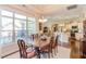 Bright dining room with hardwood floors and access to the outdoor patio and kitchen at 5144 Niagra Dr, Chapel Hill, NC 27517
