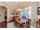 Bright dining room with hardwood floors, a large window, and natural light at 5144 Niagra Dr, Chapel Hill, NC 27517
