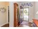 Inviting foyer with hardwood floors, decorative plates, and a view of the front yard at 5144 Niagra Dr, Chapel Hill, NC 27517