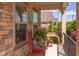 Cozy front porch featuring brick columns, rocking chairs, and a charming view at 5144 Niagra Dr, Chapel Hill, NC 27517