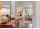 Elegant hallway showcasing hardwood floors, arched doorway, and stylish decor at 5144 Niagra Dr, Chapel Hill, NC 27517