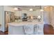 Charming kitchen with white cabinetry, stainless steel appliances, granite countertops and breakfast bar at 5144 Niagra Dr, Chapel Hill, NC 27517