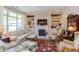 Bright living room with built-in bookshelves, fireplace, and stylish furniture at 5144 Niagra Dr, Chapel Hill, NC 27517