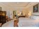 Spacious main bedroom with tray ceiling, carpeted floor, ensuite bathroom, and elegant furnishings at 5144 Niagra Dr, Chapel Hill, NC 27517