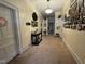 Inviting foyer with carpet flooring, complemented by Gathering photos and a decorative table at 515 E Woodall St, Smithfield, NC 27577