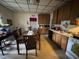 Functional kitchen with wooden cabinets, dining table, and linoleum flooring at 515 E Woodall St, Smithfield, NC 27577