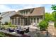 Relaxing backyard with screened porch, patio, fire pit, and outdoor seating area at 525 Morning Oaks Dr, Holly Springs, NC 27540