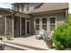 Backyard patio features outdoor seating, lush landscaping, and a serene wooded backdrop at 525 Morning Oaks Dr, Holly Springs, NC 27540