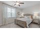 Comfortable bedroom with a ceiling fan, window and decorative bed at 525 Morning Oaks Dr, Holly Springs, NC 27540