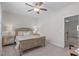 Bedroom featuring neutral walls, ceiling fan, and a decorative wooden bed at 525 Morning Oaks Dr, Holly Springs, NC 27540