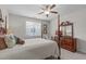 Bedroom featuring 4 poster bed, dresser and a bright window at 525 Morning Oaks Dr, Holly Springs, NC 27540