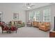 Spacious bonus room with comfortable seating and ample light at 525 Morning Oaks Dr, Holly Springs, NC 27540