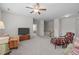 Large bonus room with cozy seating and a staircase at 525 Morning Oaks Dr, Holly Springs, NC 27540