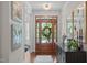 Home entryway featuring natural light, wood floors, console table, and decor at 525 Morning Oaks Dr, Holly Springs, NC 27540