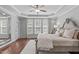 Spacious main bedroom featuring lots of natural light and hardwood floors at 525 Morning Oaks Dr, Holly Springs, NC 27540