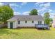 Backyard featuring grass, siding, and a wooden deck at 5317 Cottage Bluff Ln, Knightdale, NC 27545