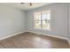 Bedroom featuring LVP flooring, with natural light at 5317 Cottage Bluff Ln, Knightdale, NC 27545