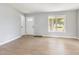 Airy living room features wood-look floors and a sunny window at 5317 Cottage Bluff Ln, Knightdale, NC 27545