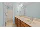 Bathroom with a double sink vanity, and a view of the tub shower at 5705 Tannibark Ln, Fuquay Varina, NC 27526