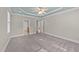 Spacious primary bedroom featuring a stylish ceiling fan and ample space for furniture at 5705 Tannibark Ln, Fuquay Varina, NC 27526