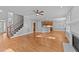 Bright living room with hardwood floors, staircase, and seamless flow into the kitchen space at 5705 Tannibark Ln, Fuquay Varina, NC 27526