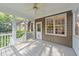 Outdoor screened porch offering a perfect place to relax and entertain guests at 5705 Tannibark Ln, Fuquay Varina, NC 27526