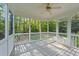 Relaxing screened porch with wooded views, perfect for enjoying the outdoors at 5705 Tannibark Ln, Fuquay Varina, NC 27526