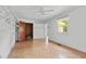 Bedroom with linoleum floors, built-in storage, and a large window for natural light at 5743 Craig Rd, Durham, NC 27712