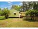 Home's exterior showcasing a well-maintained lawn and leafy shrubbery at 5743 Craig Rd, Durham, NC 27712
