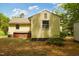 Home exterior featuring access to a basement and an AC unit at 5743 Craig Rd, Durham, NC 27712