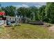 Lush backyard boasts an above-ground pool, patio seating, and mature trees offering privacy at 6237 Nc 96 Hwy W, Youngsville, NC 27596