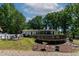 Spacious backyard featuring a above-ground pool and patio area, perfect for outdoor entertaining at 6237 Nc 96 Hwy W, Youngsville, NC 27596