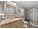 Bathroom with gray walls, granite countertops, decorative vanity, and walk-in shower at 6237 Nc 96 Hwy W, Youngsville, NC 27596