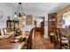 Dining room with a decorative lighting fixture, cabinets, and hardwood flooring at 6237 Nc 96 Hwy W, Youngsville, NC 27596