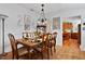 Formal dining room with hardwood floors and views of the kitchen at 6237 Nc 96 Hwy W, Youngsville, NC 27596