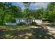 Exterior of home featuring white siding, well-maintained landscaping, and a picket fence at 6237 Nc 96 Hwy W, Youngsville, NC 27596