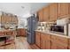 Traditional-style kitchen showcases wood cabinets, stainless steel appliances, and a convenient center island at 6237 Nc 96 Hwy W, Youngsville, NC 27596
