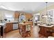 Updated kitchen with an island and views of the dining and living areas at 6237 Nc 96 Hwy W, Youngsville, NC 27596